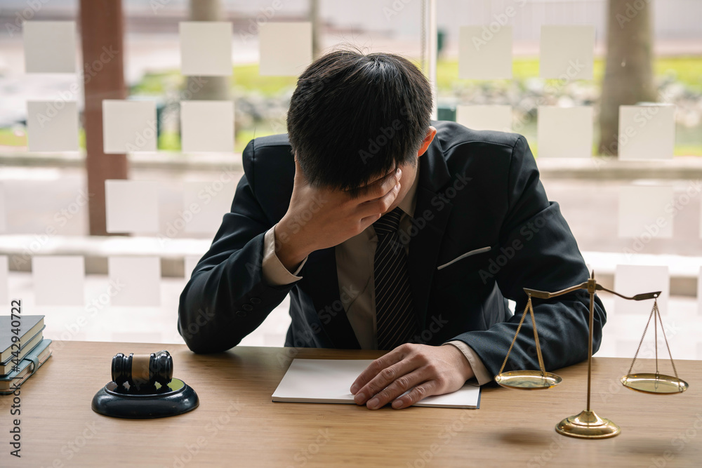 Lawyers or judges are stressed about unopening cases in the lawyer's office. legal advisor Scales of Justice, Law Hammer, Litigation and Justice Lawyers or judges are stressed about unopening cases in the lawyer's office. legal advisor Scales of Justice, Law Hammer, Litigation and Justice