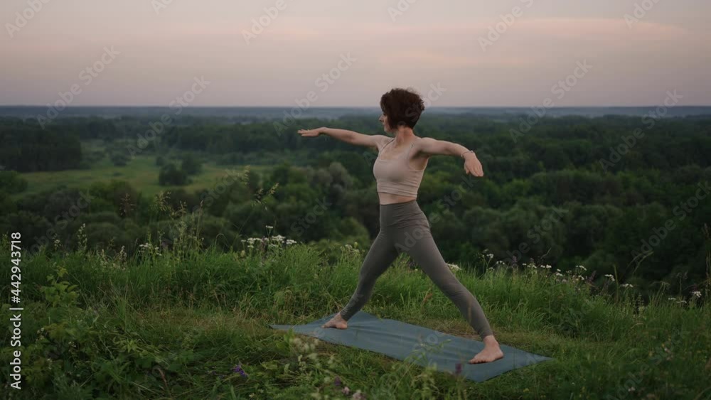 Pretty girl doing yoga and pilates in the mountain forest. Fitness girl training outdoors in landscape of nature. Pretty girl doing yoga and pilates in the mountain forest. Fitness girl training outdoors in landscape of nature.