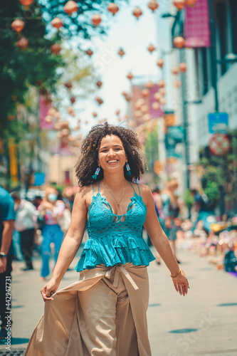 black woman happy in a city
