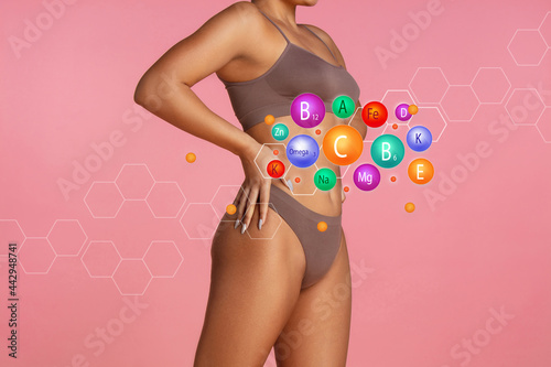 Collage about vitamins and sporty woman - body on blue background. Lifting, bodycare and healthy lifestyle concepts.