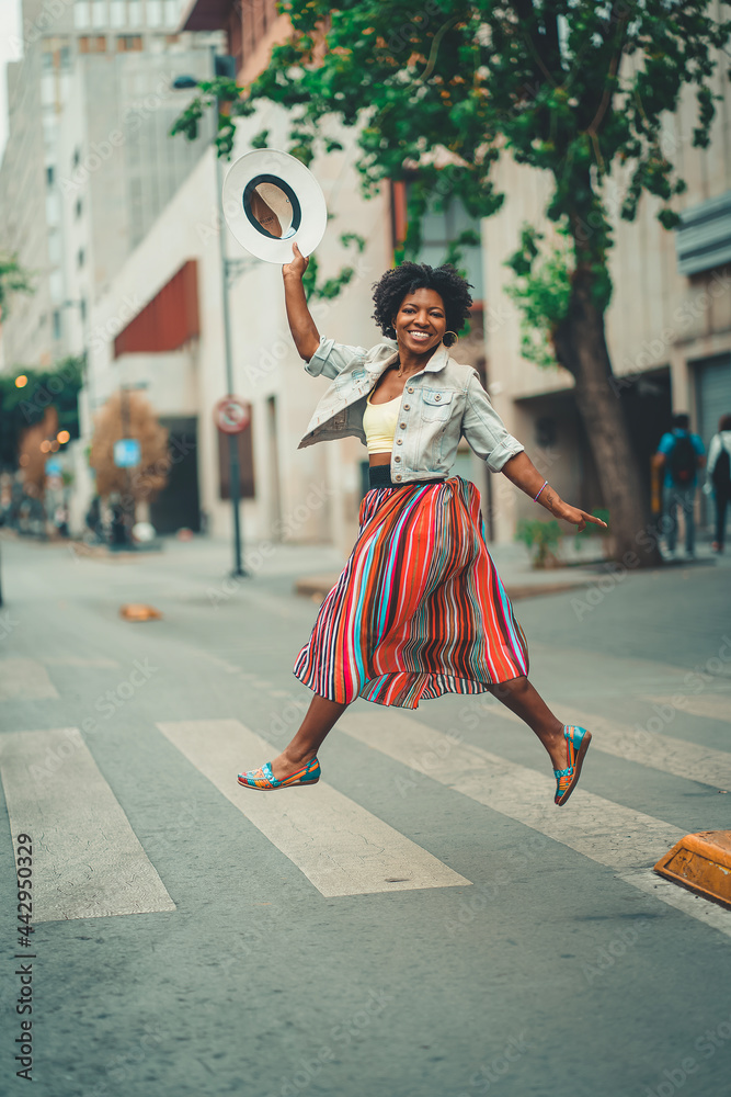 black woman dancing in the street