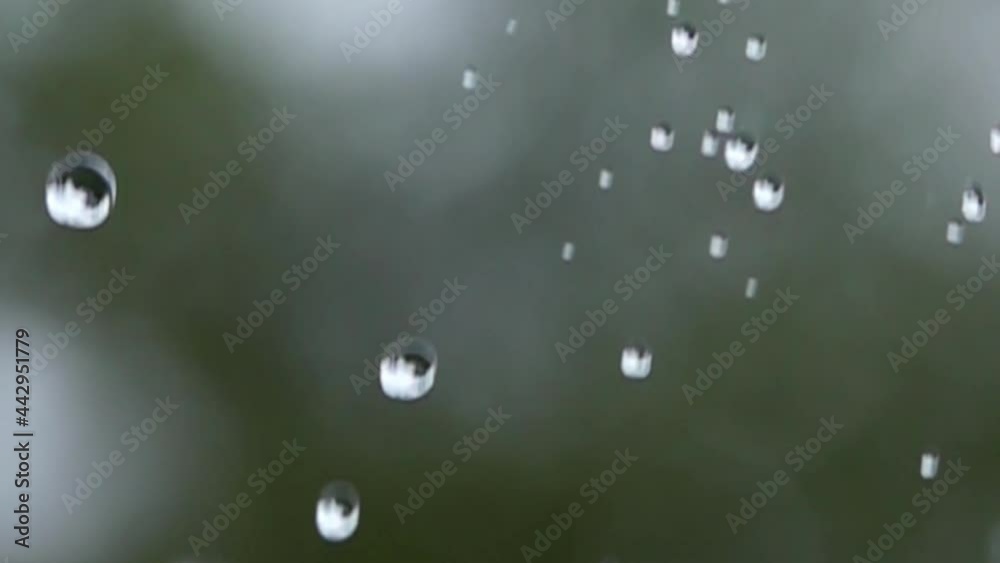 Close-up of waterdrops falling from the sky in slow motion Close-up of waterdrops falling from the sky in slow motion
