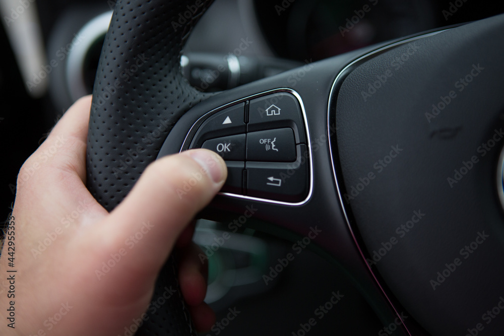 hand of a man driving  car