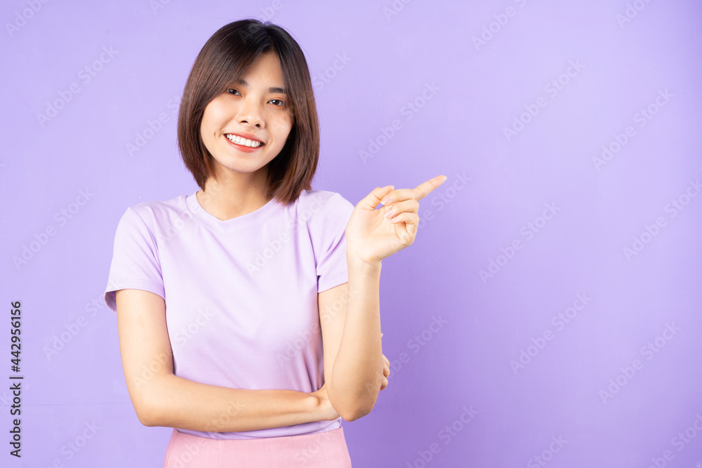 beautiful asian woman portrait, isolated on purple background beautiful asian woman portrait, isolated on purple background