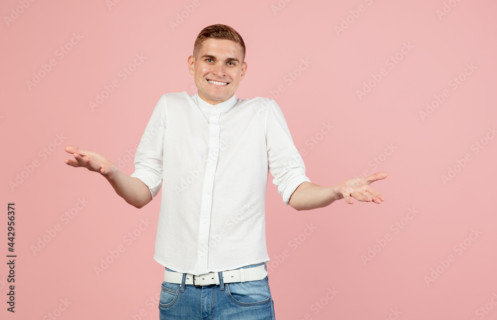 Portrait of young Caucasian man posing isolated over pink studio background with copyspace for ad. Concept of human emotions Portrait of young Caucasian man posing isolated over pink studio background with copyspace for ad. Concept of human emotions