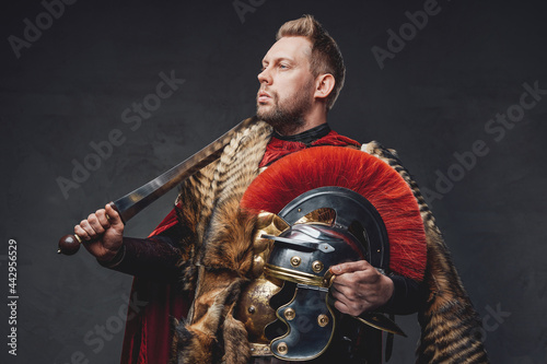 Bearded roman soldier with gladius and helmet