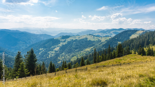 Amazing mountain landscape with blue sky with white clouds, sunny summer day in Carpathians, Ukraine © creative_content