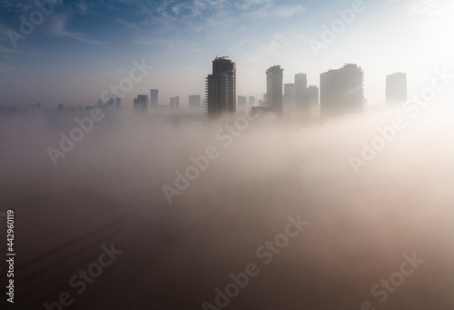 Heavy fog in Tel Aviv. View above. The city over the clouds