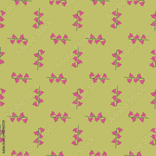 Abstract seamless pattern in geometric style with bell flower shapes. Green pale background. Pink ornament.
