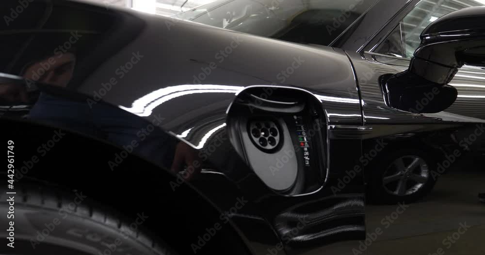 Power socket of electric car charger. Socket for electrical car battery charger with load indicator lights, selective focus. Power socket of electric car charger. Socket for electrical car battery charger with load indicator lights, selective focus.
