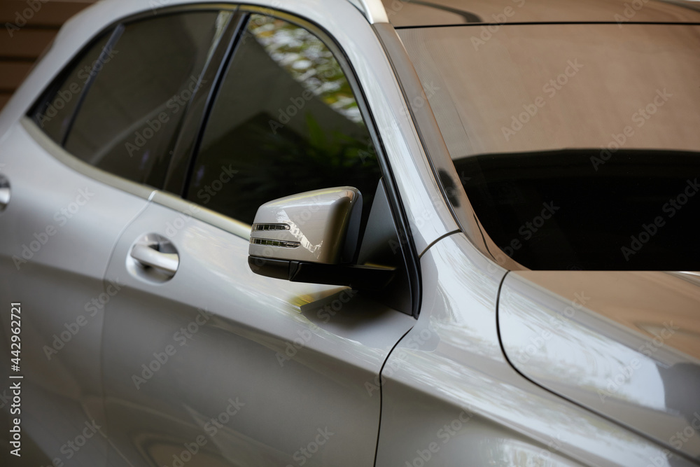 Rearview mirror or door mirror closed for safety at car park, Side