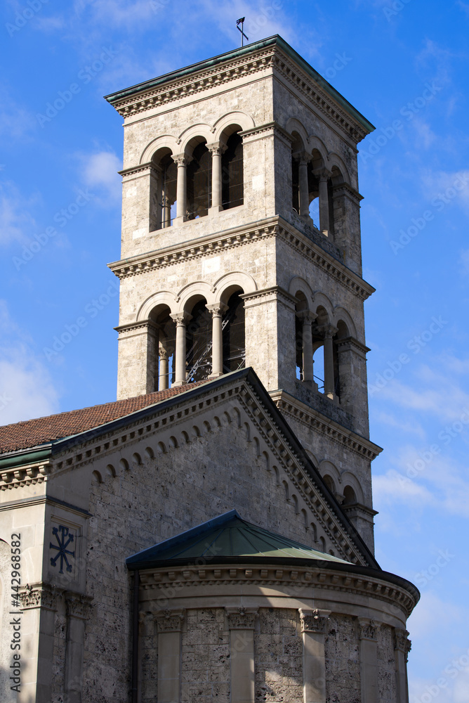Clock tower of roman catholic church named Liebfrauen at City of Zurich on a cloudy summer day. Photo taken July 2nd, 2021, Zurich, Switzerland.