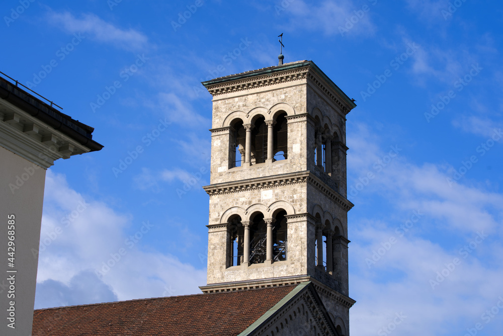 Clock tower of roman catholic church named Liebfrauen at City of Zurich on a cloudy summer day. Photo taken July 2nd, 2021, Zurich, Switzerland.