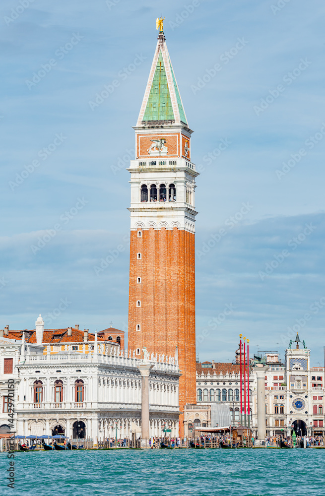 Fototapeta premium Full size view of Campanile Bell Tower at San Marco square in Venice, Italy, at sunny day and deep blue sky.