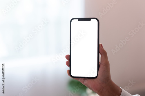 People's hands are using smartphones to scan QR codes.