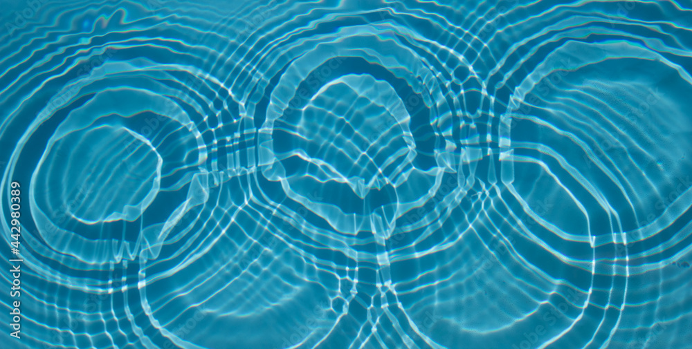 Circles on the water in the pool. Patterns on the water Circles on the water in the pool. Patterns on the water