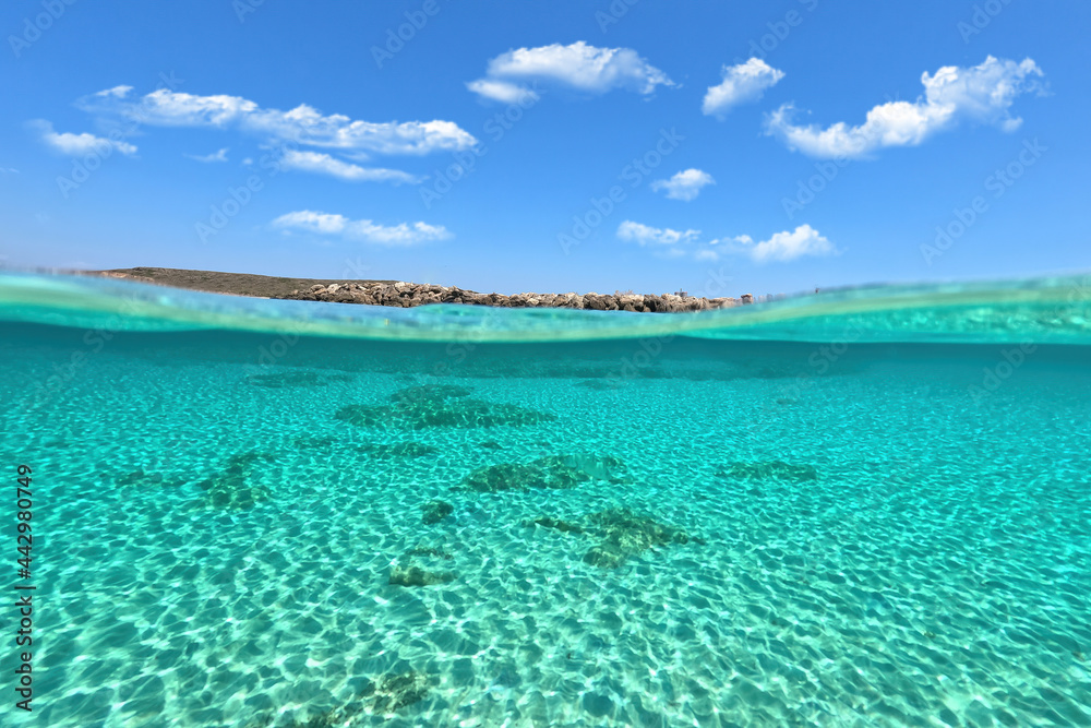 Sea level and underwater split photo of paradise sandy beach of Diakofti with turquoise crystal clear sea in island of Kythira, GReece