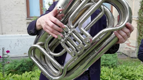 Closeup of professional musician playing the tuba photo