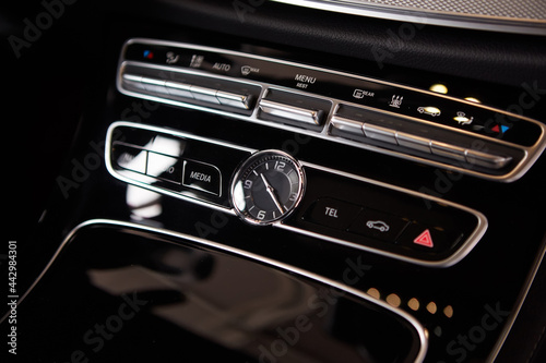 Luxury car interior details. Middle console with air and multimedia controls © sarymsakov.com