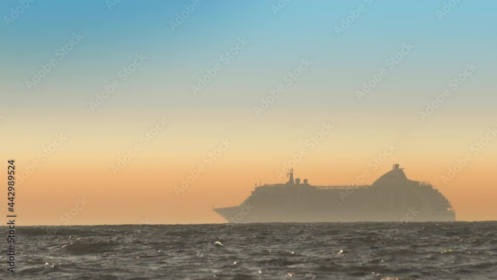 Big cruise liner moored in Mediterranean sea horizon at sunset Big cruise liner moored in Mediterranean sea horizon at sunset