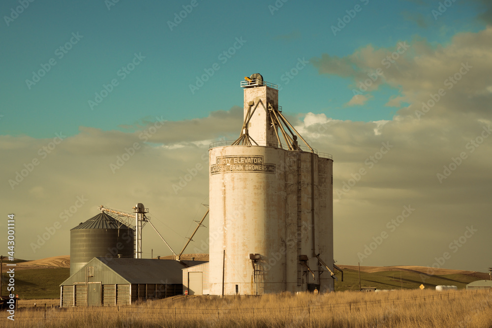 View of industrial grain elevator seen from wheat farm in the Palouse Washington state View of industrial grain elevator seen from wheat farm in the Palouse Washington state