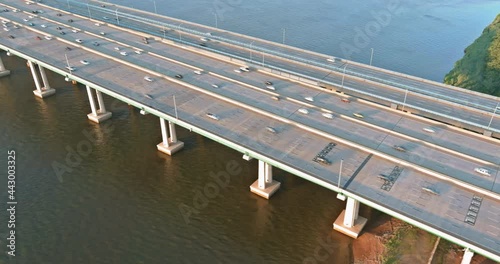 Traffic on the motorway in the road Alfred E. Driscoll Bridge over the water across Raritan River with heavy traffic on rush hour in of Woodbridge town New Jersey photo