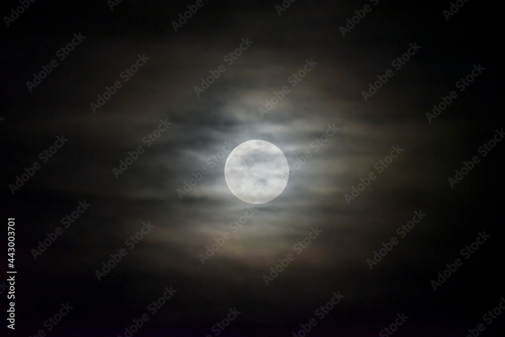 Full Moon in Night Sky with Cloudy Haze