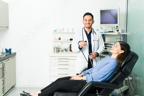 Portrait of a physician with a patient at his office