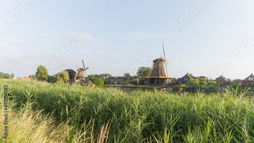 Traditional dutch windmills De Vriendschap and De Eendragt in the city of Weesp