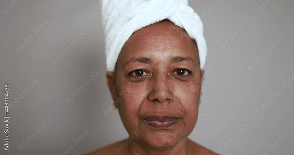 Mature african woman looking serious on camera - Beauty day, skin care therapy and real people concept Mature african woman looking serious on camera - Beauty day, skin care therapy and real people concept