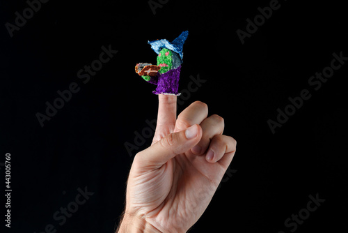 Scary baby finger puppets made of papier mache on hand isolated