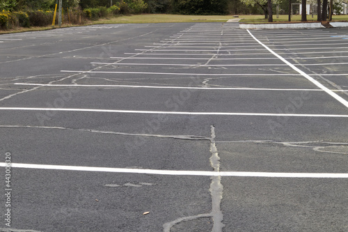 A empty paved repaired parking lot with white lines
