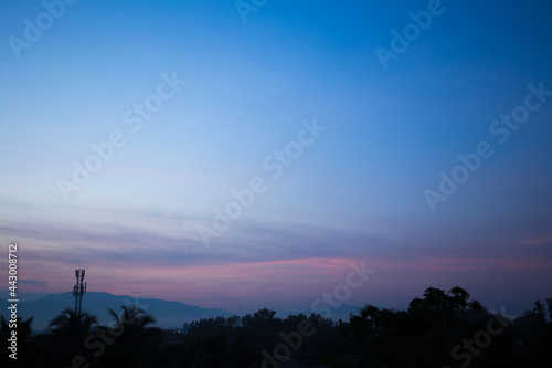 Colorful dramatic sky with cloud at Sunrise.Sky with sun background © kaiskynet