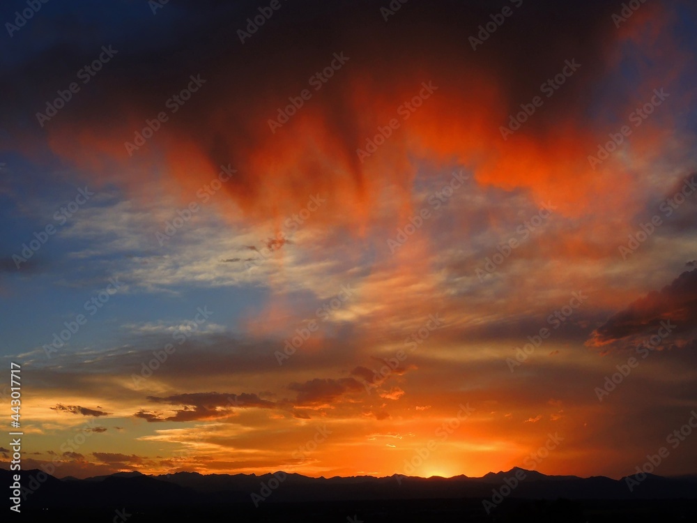 Fiery sunset along the colorado  Rocky Mountain   front range, as seen from Broomfield, colorado 