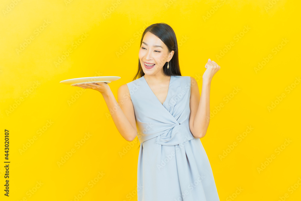 Portrait beautiful young asian woman smile with empty plate dish Portrait beautiful young asian woman smile with empty plate dish