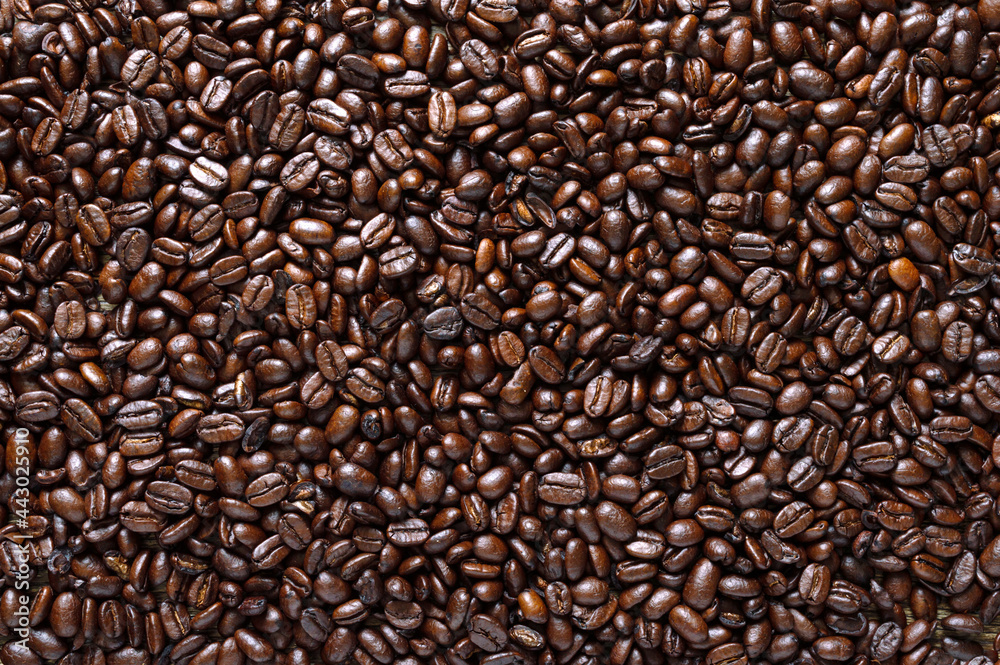 Obraz premium Roasted full coffee beans. Coffee background. Top view, flat lay