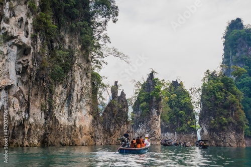 the atmosphere at the famous tourist places in southern Ratchaprapa Dam, there are many of tourist come visit here and cruising local boat for sightseeing around.