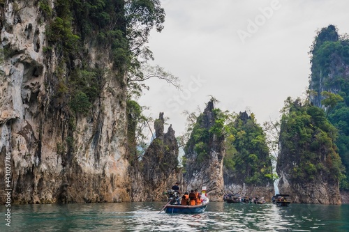 the atmosphere at the famous tourist places in southern Ratchaprapa Dam  there are many of tourist come visit here and cruising local boat for sightseeing around.