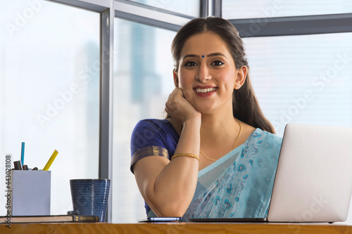 A woman working on laptop.