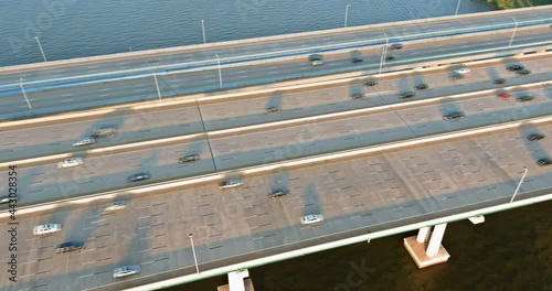 Traffic on the motorway in the road Alfred E. Driscoll Bridge over the water across Raritan River with heavy traffic on rush hour in of Woodbridge town New Jersey photo