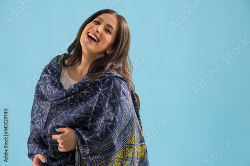 Portrait of a woman wearing ethnic laughing. photo