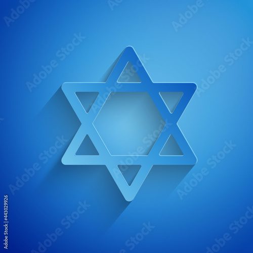 Paper cut Star of David icon isolated on blue background. Jewish religion symbol. Symbol of Israel. Paper art style. Vector