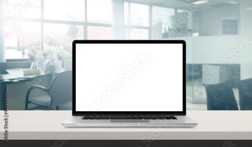 Laptop or notebook with blank screen on bank service counter or office in blurry background for banner or wallpaper business and finance