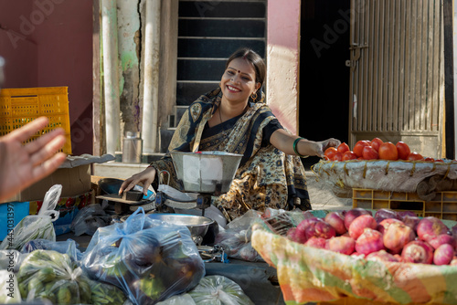Принти на полотні A RURAL WOMAN HAPPILY SELLING VEGETABLES