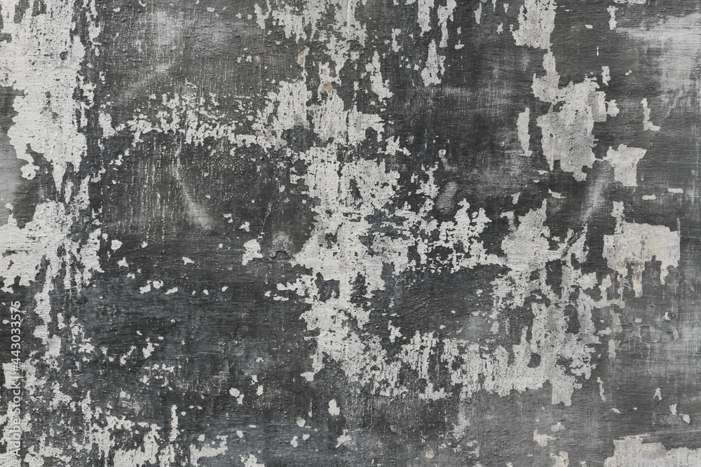 abstract gray painted old wall for background or texture, peeling paint and stucco with cracks like grunge style