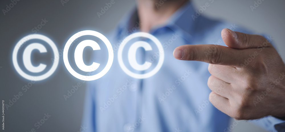 Man shows a Copyright symbol. Intellectual Property Man shows a Copyright symbol. Intellectual Property