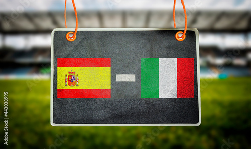 Euro 2021, Spain vs Italy on hanging chalkboard with blurred stadium background