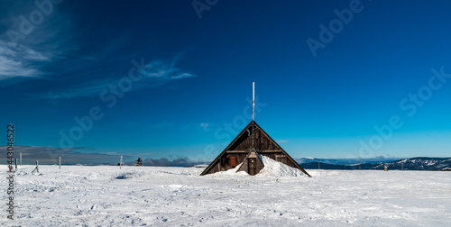 Vysoka hole hill summit with hut in winter Jeseniky mountains in Czech republic photo