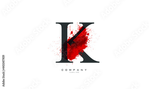 K alphabet letter logo for business and company with black color and blood design. Corporate branding and icon lettering with blood splash splash style