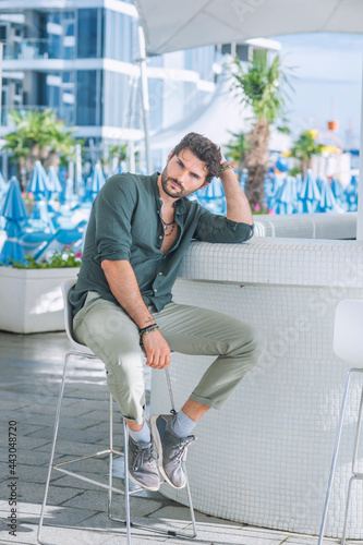 Sexy man model dressed in green shirt